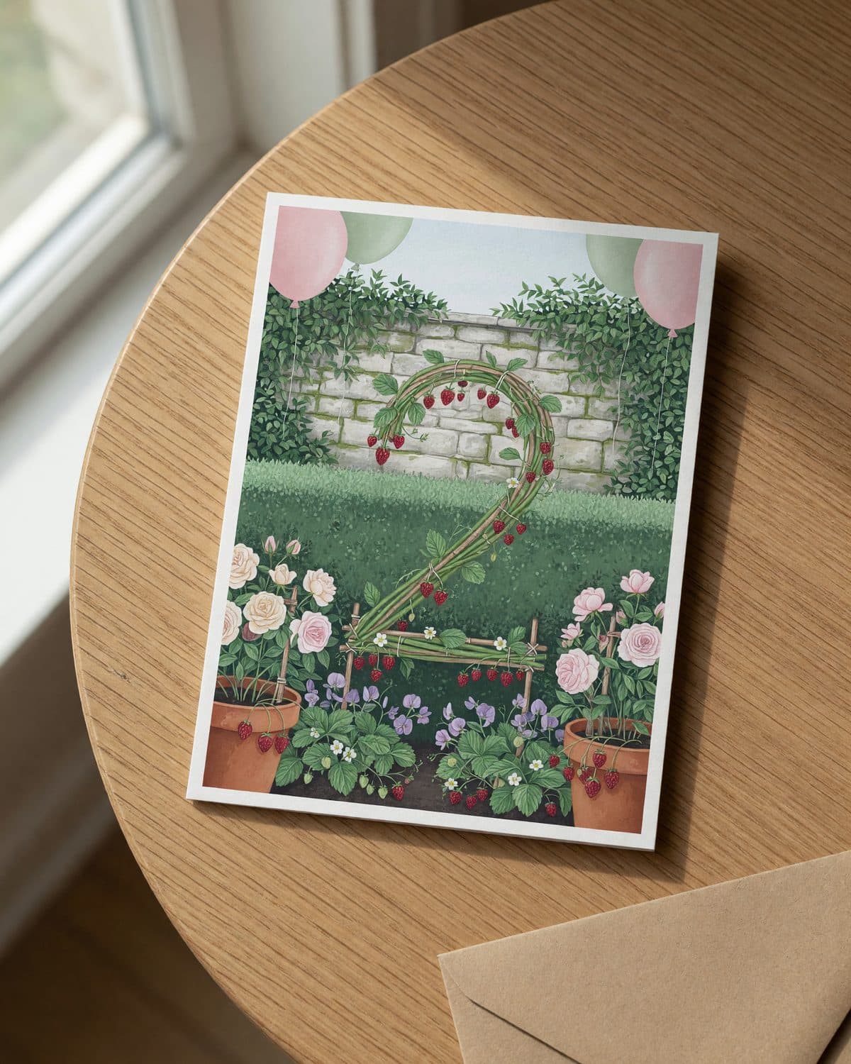 A printed garden number invitation lying flat on a wooden table, seen from above.